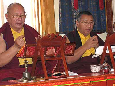Image of two Tibetan monks leading a meditation